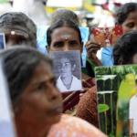 Sri Lankan Tamils hold pictures of family members who disappeared during the war against the LTTE at a protest in Jaffna